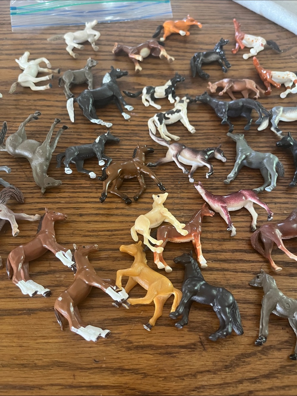 Small plastic toy horses